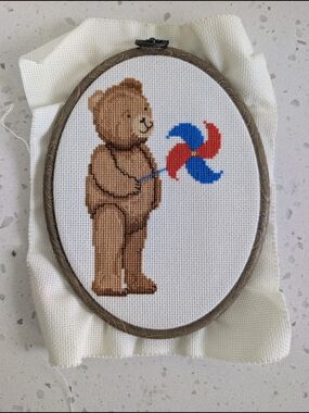 Brown Teddy Bear Cross Stitch with Red & Blue Pinwheel